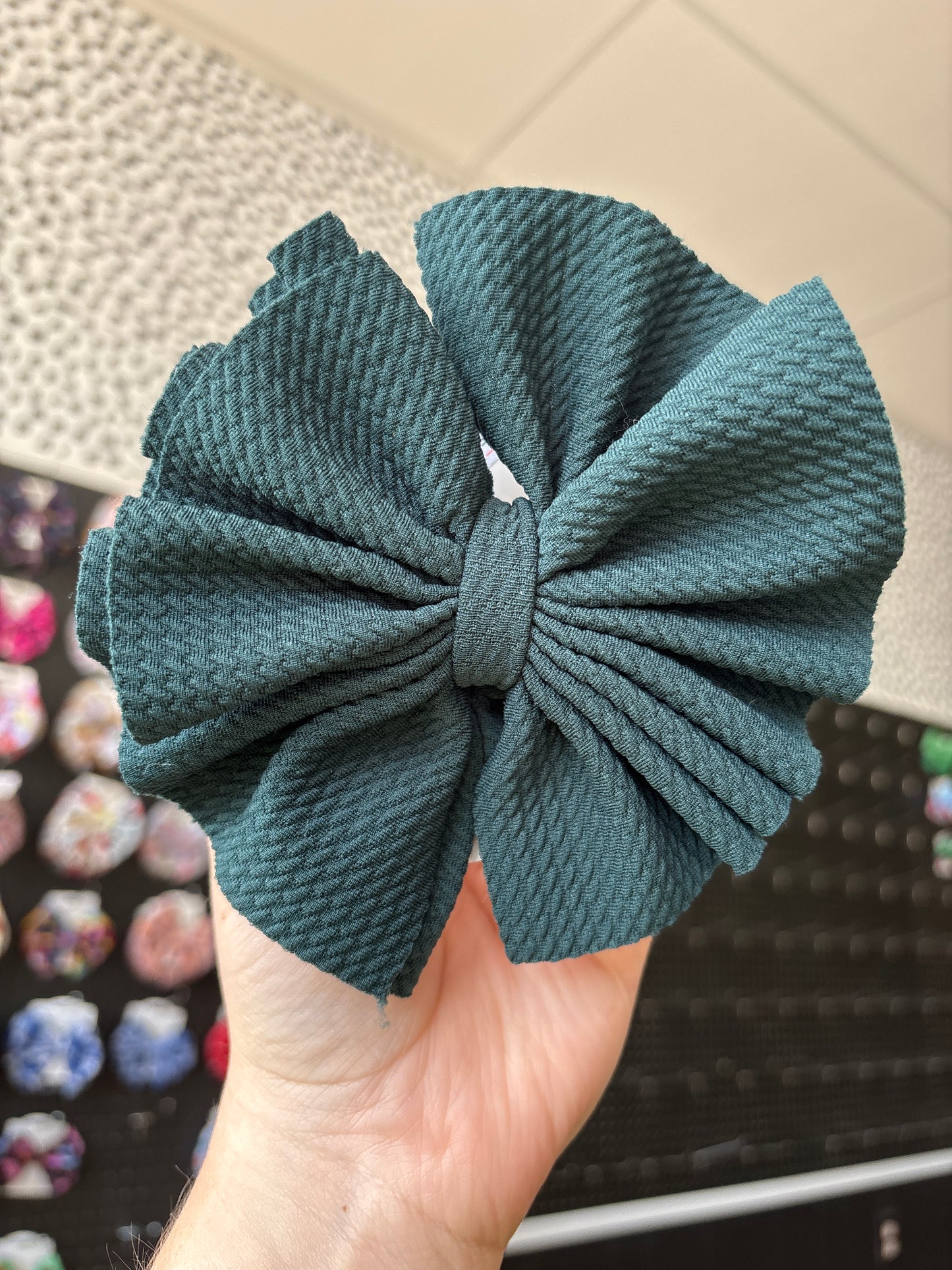 Peacock green shredded clip bow