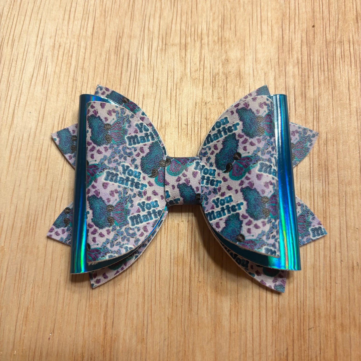 You matter-faux leather bows