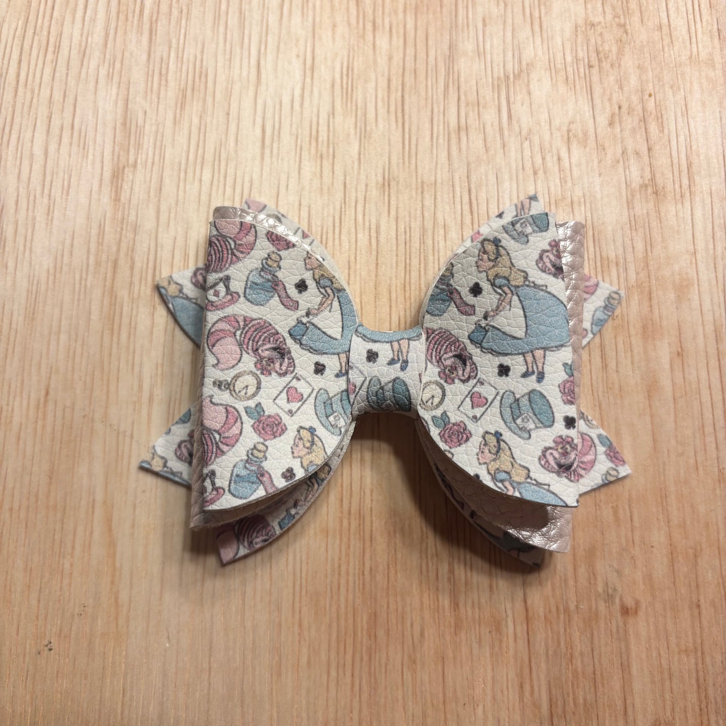 Wonderland- faux leather bows